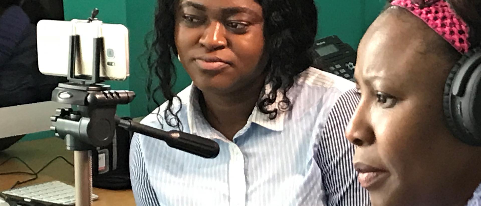 Women making a film with a smartphone