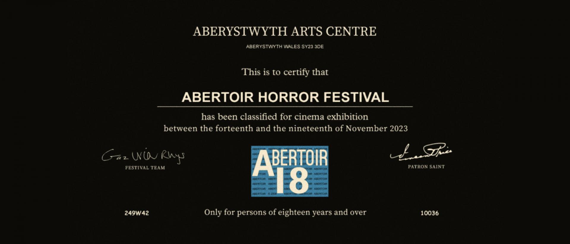 a black screen with white text that reads: Aberystwyth Arts Centre. This is to certify that ABERTOIR HORROR FESTIVAL has been classified for cinema exhibition between the fourteenth and nineteenth of November 2023.