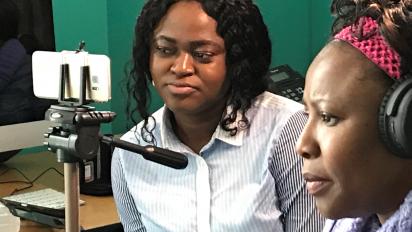 Women making a film with a smartphone