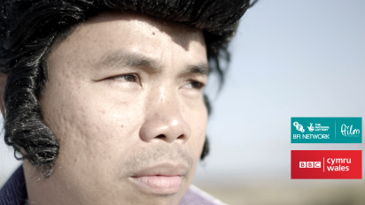 a still from short documentary Pink Suede Shoes featuring a close up portrait of an Elvis impersonator