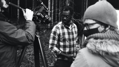 short film jackdaw being shot. The crew are outside in a forest.